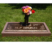 Bronze marker with integrated vase on a granite base