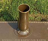 Bronze marker with integrated vase